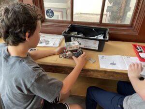 A TECH Unleashed member builds a Lego Mindstorms robot at the Boundless Connections Technology Center in Olean.